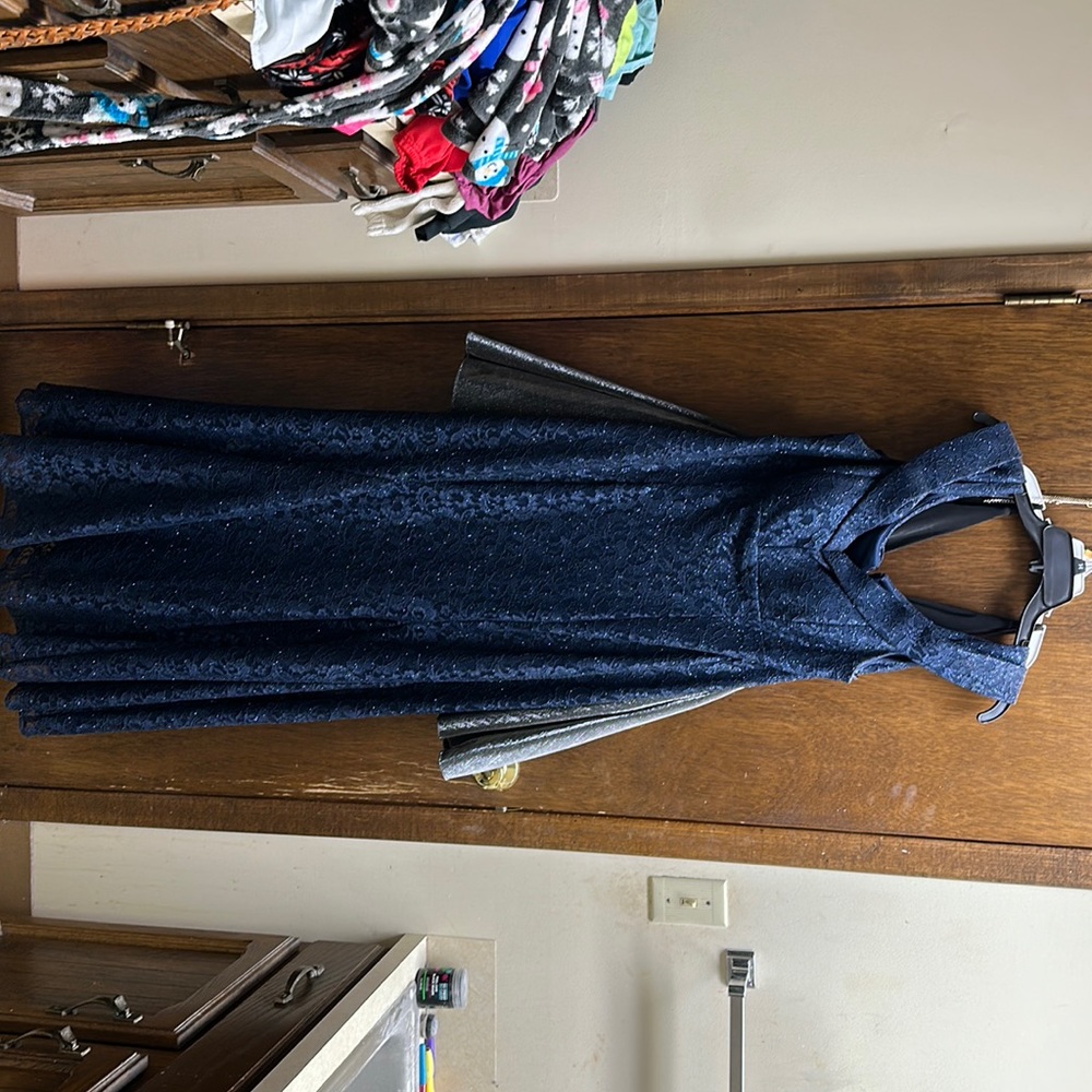 Navy blue, sparkly, prom dress. It was a bit long on me and I’m 5’0.